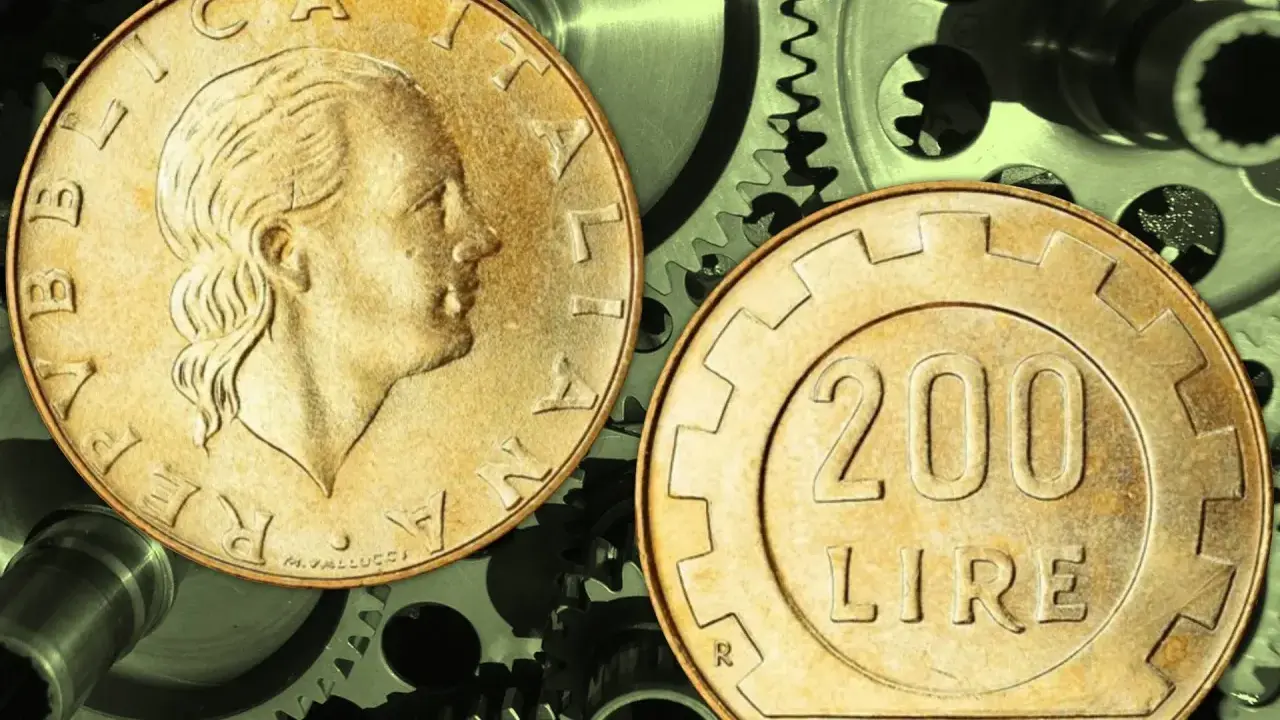 Due monete da 200 lire su ingranaggi metallici. Quanto guadagna un quadro metalmeccanico?
