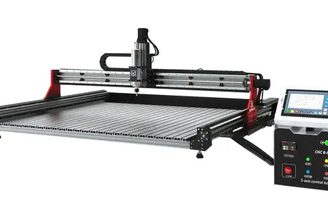 A CNC milling machine with a touch screen control box.